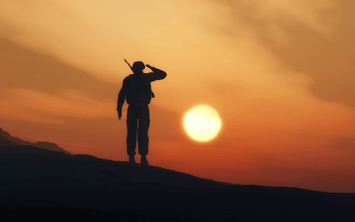 Imagem de uma sombra de um soldado fazendo continência ao por do sol para simbolizar doenças que impedem de servir o exército